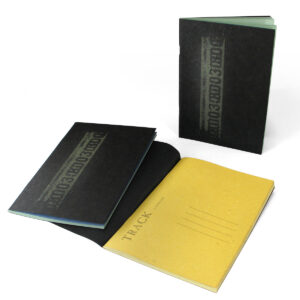 Track plain notebook in A5 with Tar Paper® cover and straw paper pages, 2 assorted colors.
